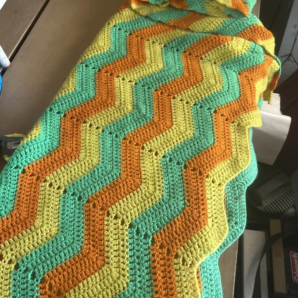 a vintage handmade crochet ripple or chevron pattern blanket 50